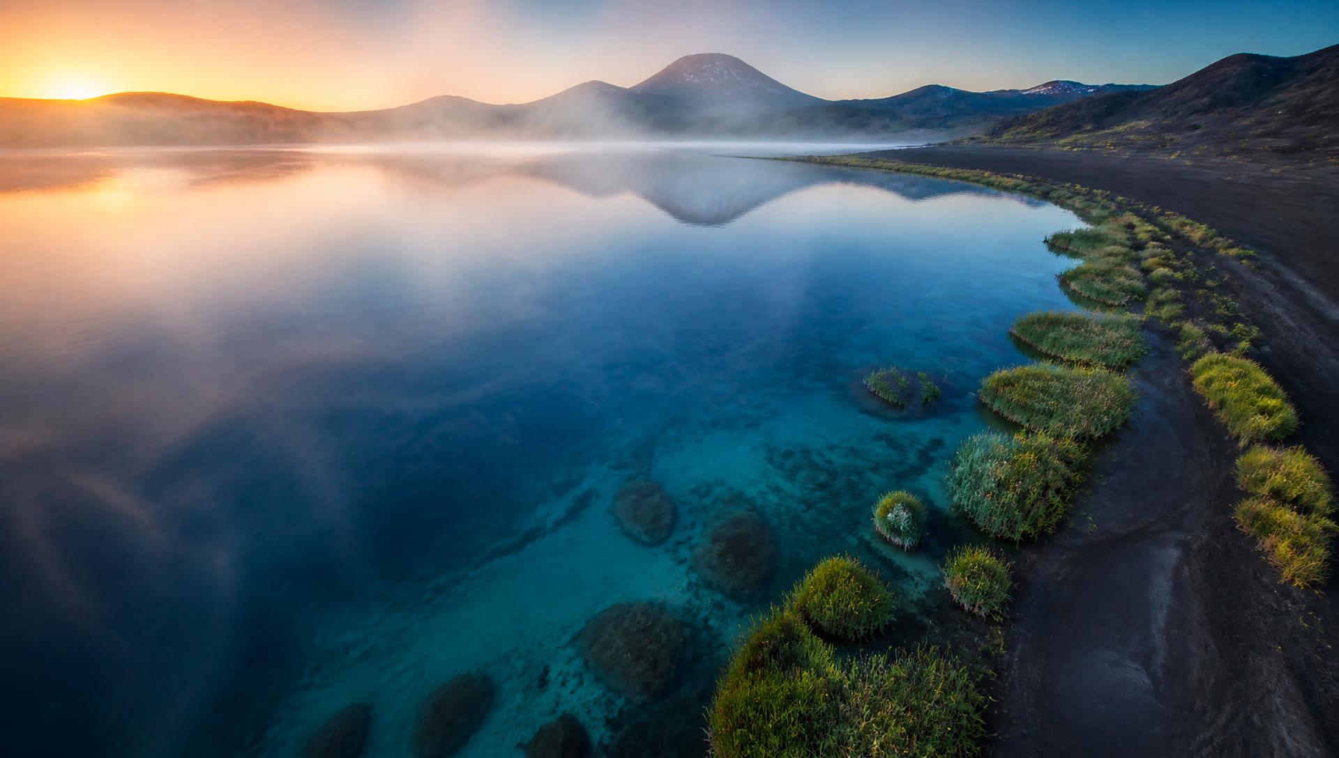 Clear volcanic lake at dawn